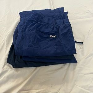 Five pairs of scrub bottoms. Size small and medium